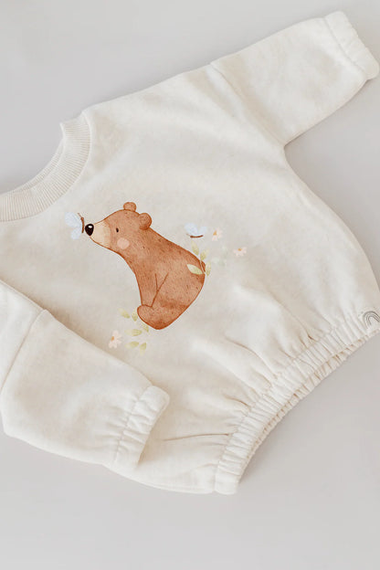Beispielbild eines aufgebügelten Motivs auf einem hellen Kinderpullover