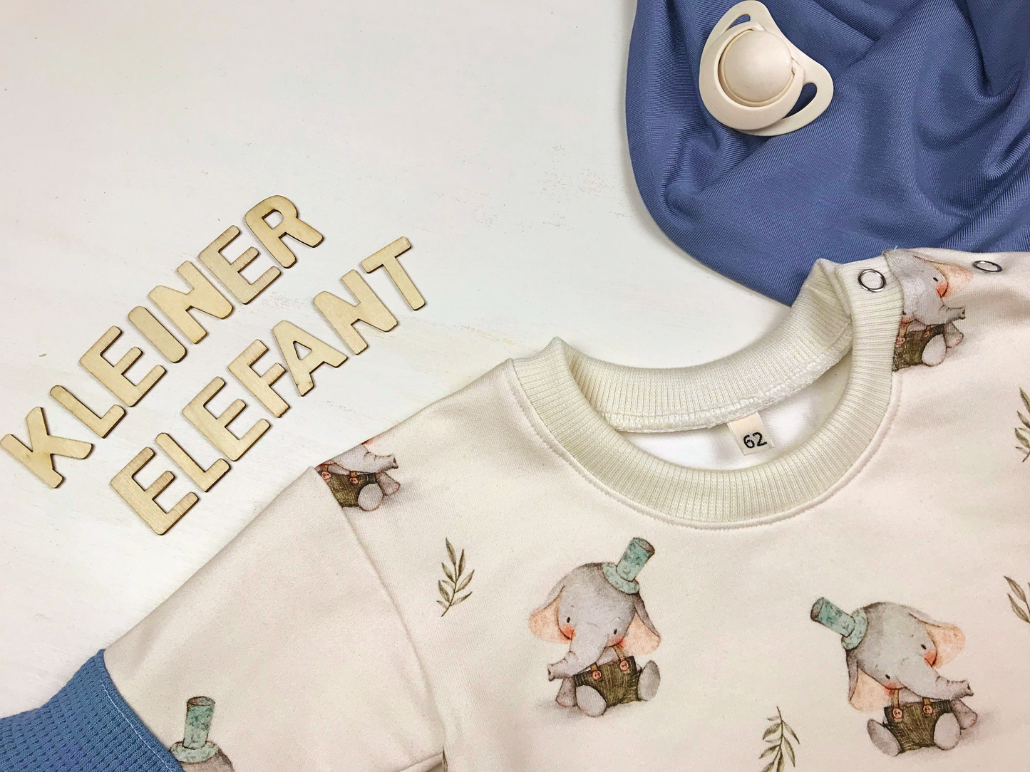 Baby- und Kleinkindpullover mit Elefantenmotiv